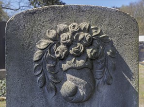 Relief with rose petals on a Jewish gravestone