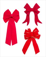 Set of three red bows and ribbons on white background