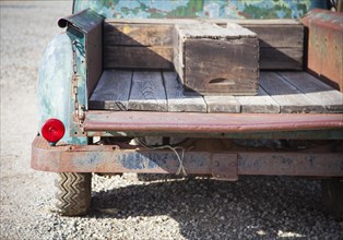 Abstract of old rusty antique truck bed in a rustic outdoor setting