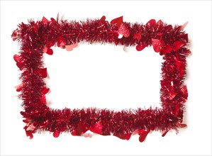 Red tinsel with hearts border frame shape on a white background ready for your own message
