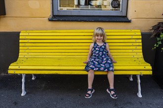 Girl sitting on a bench