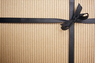 Corrugated gift box with black satin ribbon