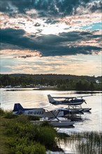 Waterplane at sunset on Lake Inari