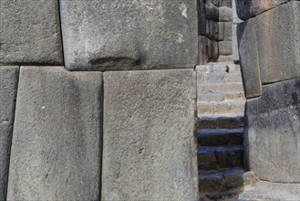 Stone gate in the fortress walls of the Inca ruins Sacsayhuaman