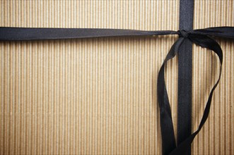 Corrugated gift box with black satin ribbon
