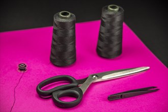 Black tailoring accessories as scissors