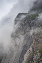 View from Helvetestinden to rock face of Mount Storskiva