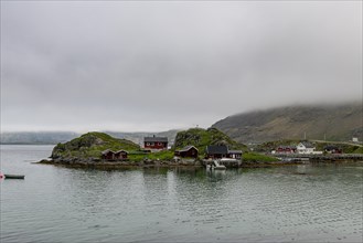 Remote little bay and settlement along the road to the Nordkapp