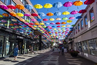 Open Umbrellas hanging over the pedestrian zone of Trondheim