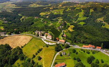Aerial view of green hills and vineyards