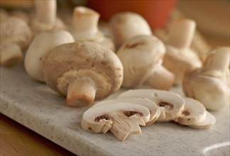 Delicious fresh sliced mushrooms on a cutting board