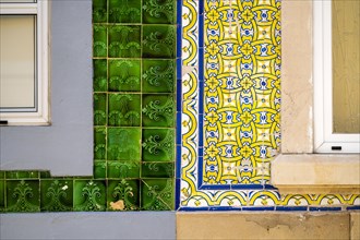 Close up of typical tiles on the facades of old houses in Olhao