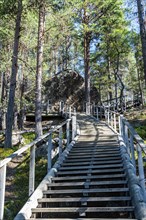 Wooden stairs to the 'Bear's Den' Tafone Rock