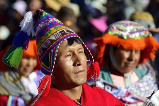 Portrait of an indigenous man in traditional traditional costume during a parade on the eve of Inti Raymi