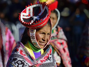 Portrait of an indigenous woman in traditional traditional costume during the parade on the eve of Inti Raymi