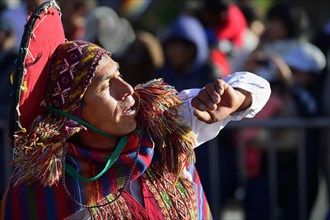 Portrait of an indigenous woman in traditional traditional costume during the parade on the eve of Inti Raymi