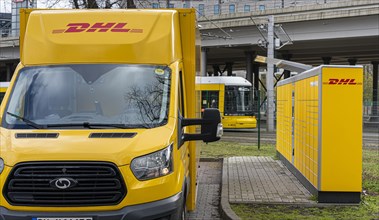 DHL Packstation with DHL delivery vehicle
