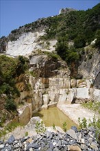 Terraced rock face in open pit carrara marble mines or quarries