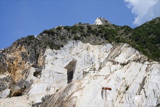 Terraced rock face in open pit carrara marble mines or quarries