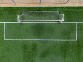Aerial view of goal on soccer pitch covered with artificial grass in Altea La Vella