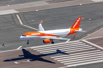 An Easyjet Airbus A320 with the registration G-EZRM lands at Gibraltar Airport