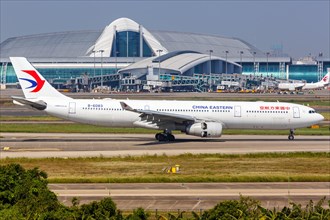 An Airbus A330-300 aircraft of China Eastern Airlines with registration number B-6083 at Guangzhou Baiyun Airport