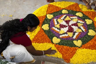 Athapookalam the traditional floral carpet made in the front courtyard for 10 days in every house during the season of Onam festival in Kerala