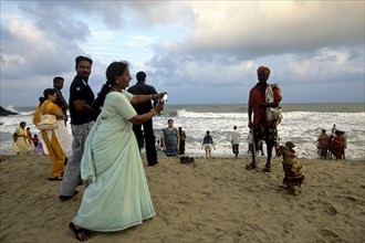 Tourists in Mahabalipuram beach near Chennai