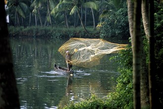 A fisherman throwing a fishing net