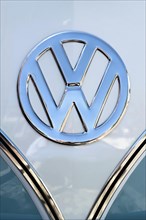 Chrome VW logo on the front of a Volkswagen Type 2 Transporter