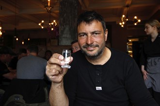 Man in Apotek restaurant drinking Brennivin