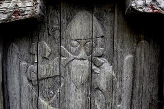 Wooden door with Viking figure