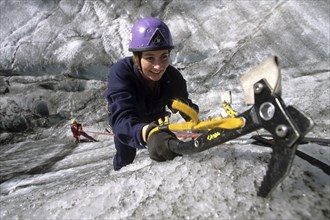 Woman with ice axe climbing