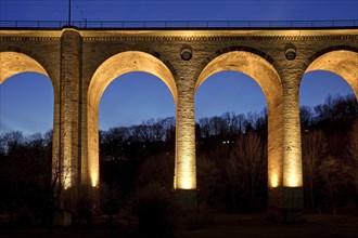 Illuminated viaduct in the evening