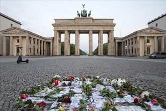 Brandenburg Gate with silent protest on Pariser Platz in the early morning