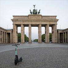 Brandenburg Gate with parked e-scooter on Pariser Platz in the early morning