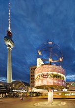 Alexanderplatz with the Berlin TV Tower and the Urania World Clock in the evening