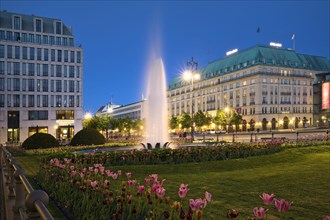 Pariser Platz with fountain and Hotel Adlon Kempinski in the evening