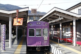 Purple tram train of Randen Arashiyama Line waiting at Shijo-Omiya Station
