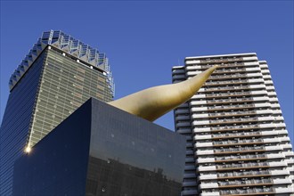 Asahi Breweries headquarters building with the Asahi Flame by french designer Philippe Starck on the east bank of the Sumida River in Sumida district