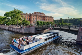 Tourists on a boat near the Mikhailovsky Castle