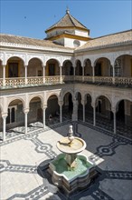 Inner courtyard with archways and fountain
