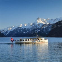 View from Brunnen on a boat on the Lake of Uri in front of the mountain scenery of the Alps of Uri