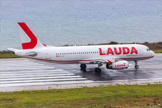 A Lauda Airbus A320 aircraft with registration number OE-LOZ at Corfu Airport