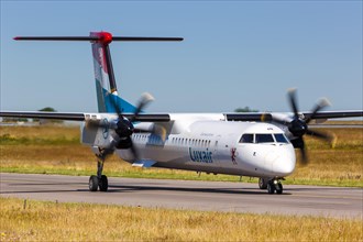 A Bombardier DHC-8-400 of Luxair with the registration LX-LGM at Luxembourg Airport