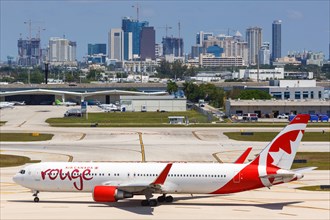 A Boeing 767-300ER of Air Canada Rouge with the registration C-GHLT at Fort Lauderdale Airport