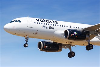 A Volaris Airbus A320 aircraft with registration XA-VOY lands at Los Angeles Airport