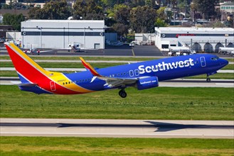 A Southwest Airlines Boeing 737-800 aircraft with registration number N8664J takes off from San Jose Airport