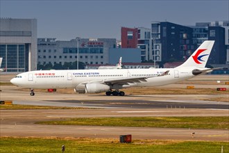 An Airbus A330-300 of China Eastern Airlines with registration number B-6085 at Shanghai Hongqiao Airport