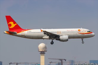 A Tianjin Airlines Airbus A320 with registration number B-6903 at Shanghai Hongqiao Airport